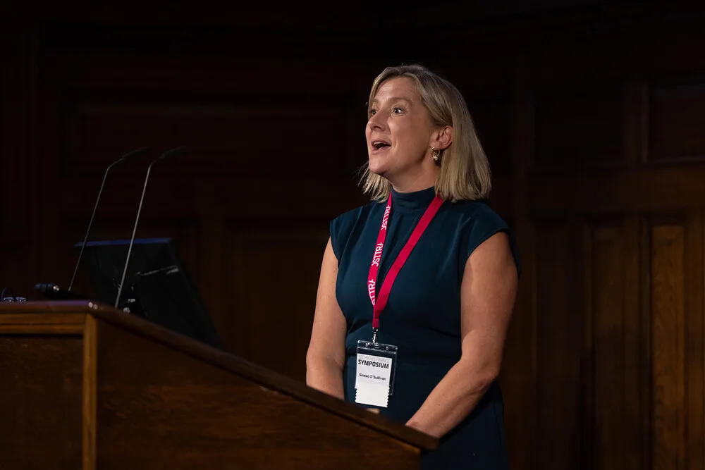 Sinead O'Sullivan mid-sentence, addressing the audience