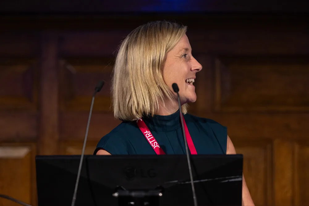 Sinead O'Sullivan laughing while presenting