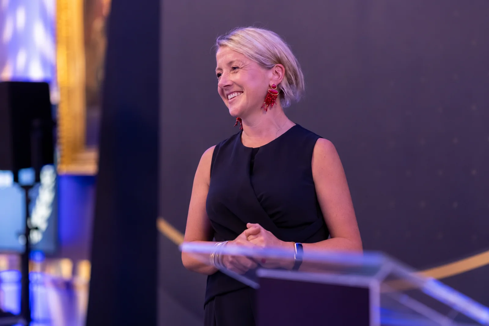 Sinead O'Sullivan speaking at a panel podium